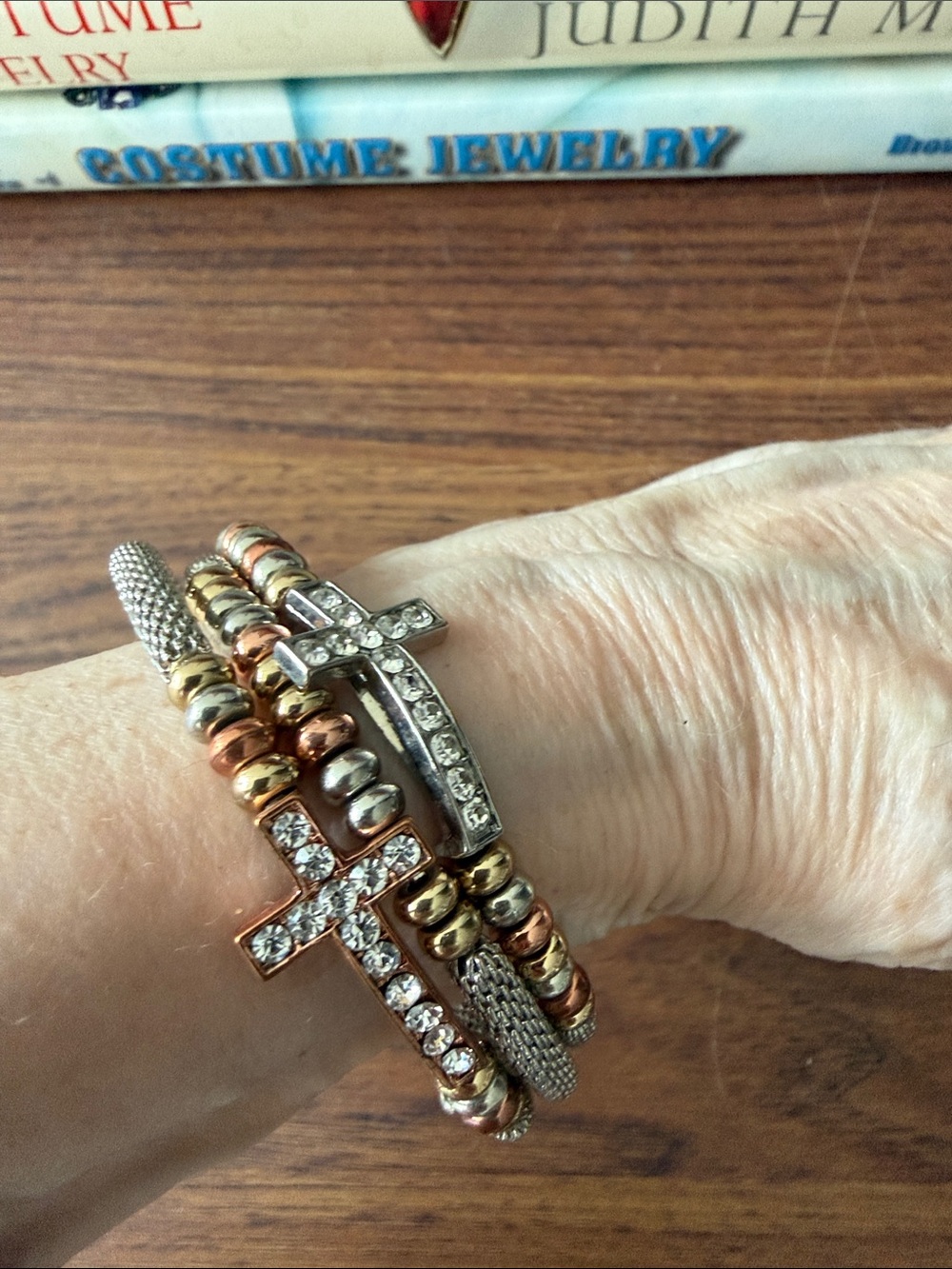 Silver Tone Coil Bracelet with 3 Rhinestone Crosses & Tri Color Beads.